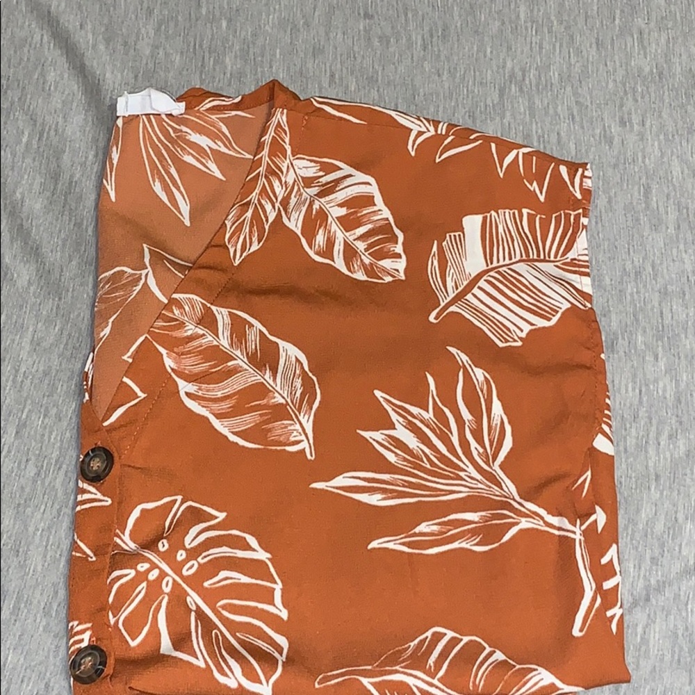 I’m selling a formal shirt with leaf patterns